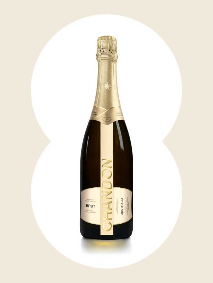 Product image of Chandon Brut Australia sparkling wine. The bottle has a metallic gold foil neck and a sleek, dark glass body with a vertical gold label. The label reads 'CHANDON' in large letters, 'BRUT' below it, and 'AUSTRALIA' oriented vertically on the right side of the main label. This premium sparkling wine bottle is ideal for product page display.