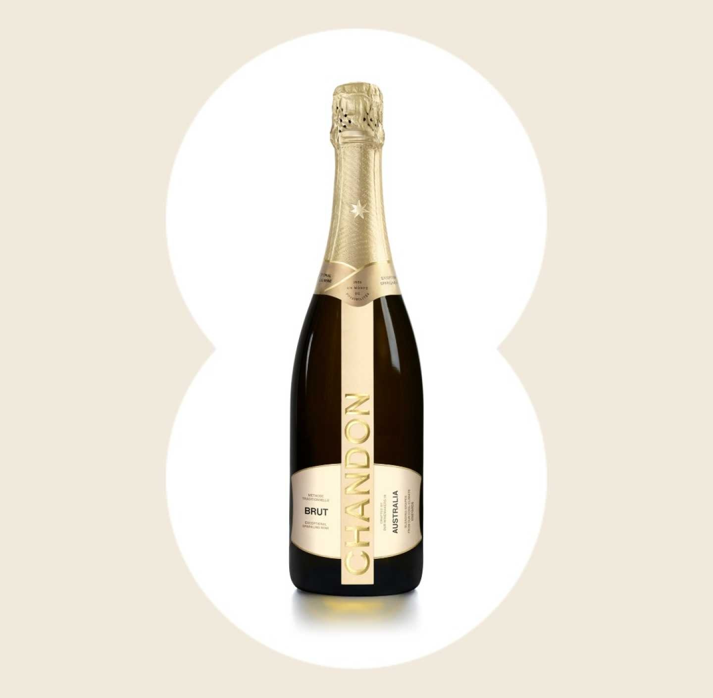 Product image of Chandon Brut Australia sparkling wine. The bottle has a metallic gold foil neck and a sleek, dark glass body with a vertical gold label. The label reads 'CHANDON' in large letters, 'BRUT' below it, and 'AUSTRALIA' oriented vertically on the right side of the main label. This premium sparkling wine bottle is ideal for product page display.