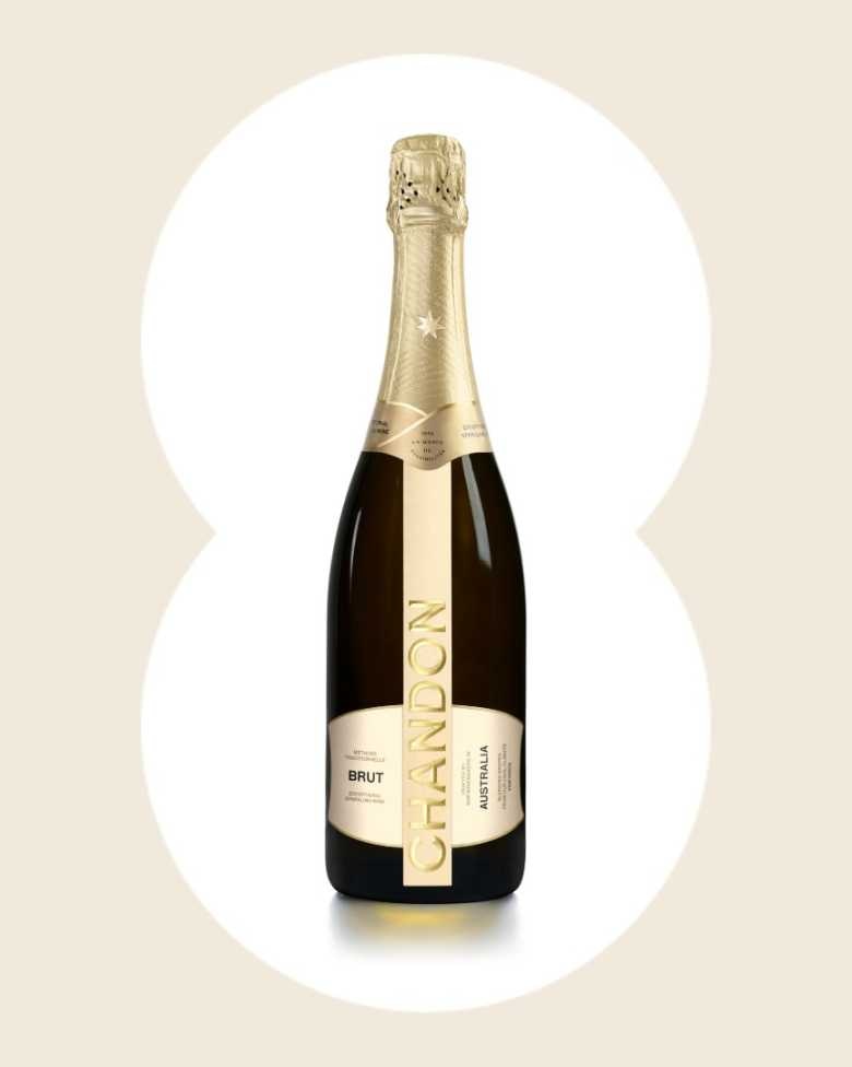 Product image of Chandon Brut Australia sparkling wine. The bottle has a metallic gold foil neck and a sleek, dark glass body with a vertical gold label. The label reads 'CHANDON' in large letters, 'BRUT' below it, and 'AUSTRALIA' oriented vertically on the right side of the main label. This premium sparkling wine bottle is ideal for product page display.